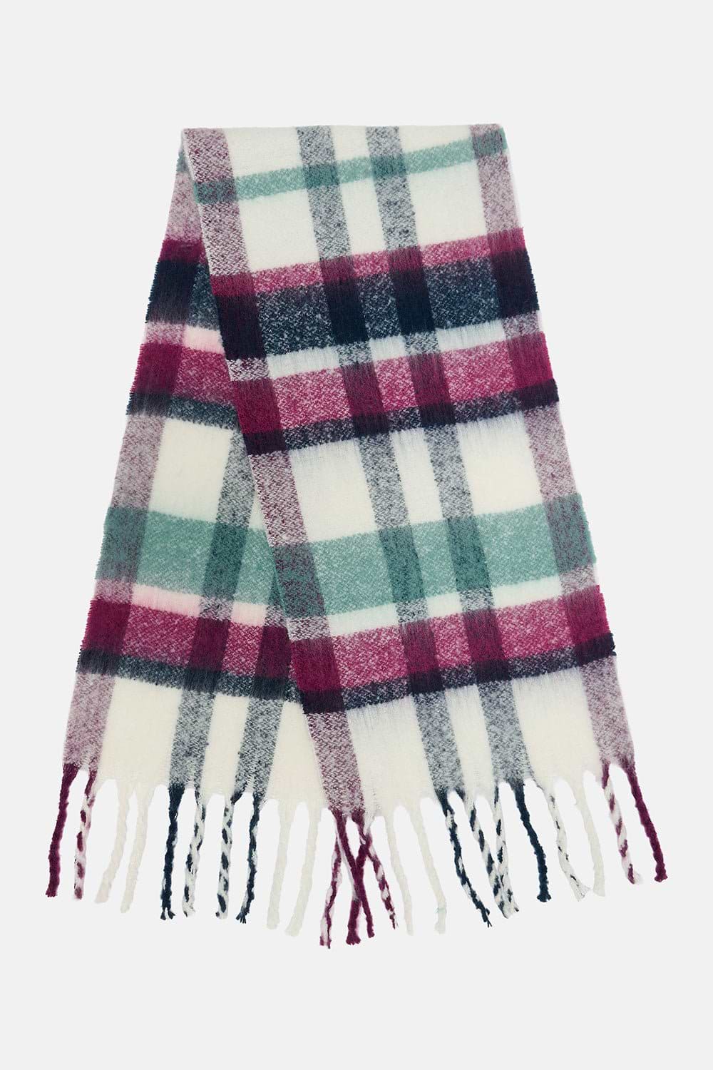 A soft woven scarf with a plaid pattern in white, dusty pink, teal green, and navy blue, finished with fringed ends, shown against a plain light gray background.
