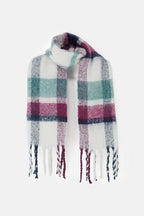 Plaid scarf with fringe on a white background