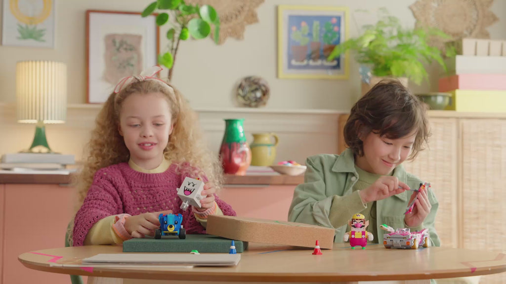 LEGO Super Mario Mario Kart Wario & King Boo set (72038) showing Wario's Badwagon, King Boo’s Teddy Buggy, shell-launch action, drifting and glider features.