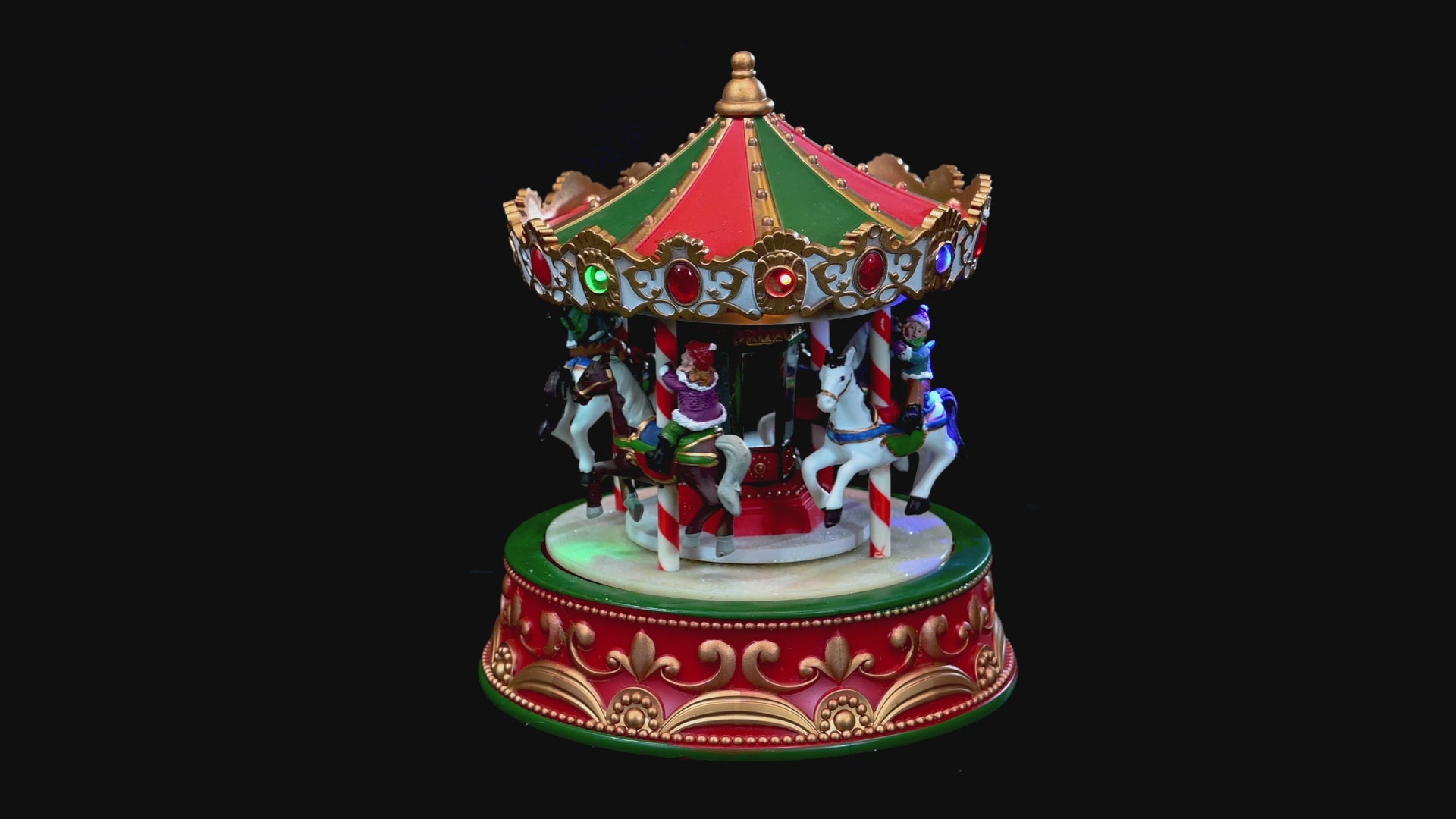LED Winter Carnival Carousel with flashing multicolour lights, movement, and music – 23 cm indoor holiday scene decoration