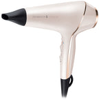 White and rose gold hair dryer with black nozzle on a white background