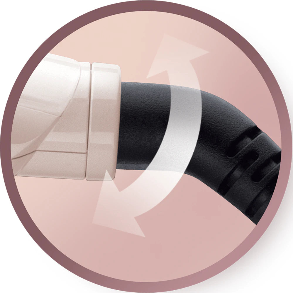 Close-up of a black and white object on a pink background