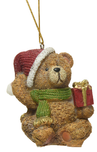 Teddy bear ornament with a red hat, green scarf, and gift box on a white background