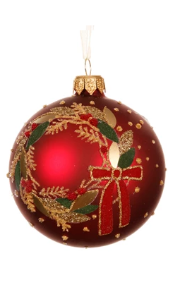 Red Christmas ornament with gold wreath and bow on a white background