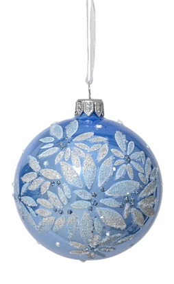 Blue glass ornament with silver floral pattern on a white background