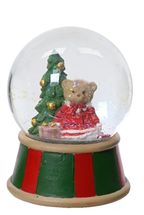 Christmas-themed snow globe with a bear and tree inside, on a white background