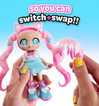 Toy figure with switchable hair extensions held by hands against a blue background