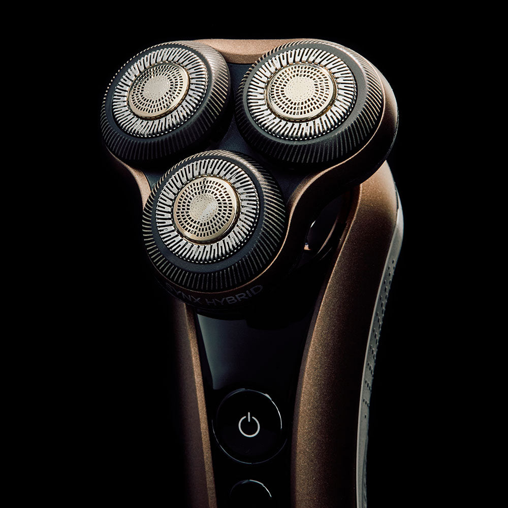 Electric shaver with three heads on a black background