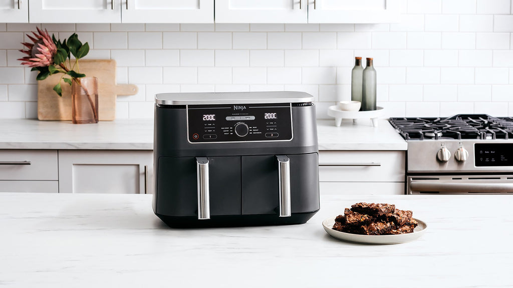 Black Ninja dual zone air fryer in modern kitchen setup